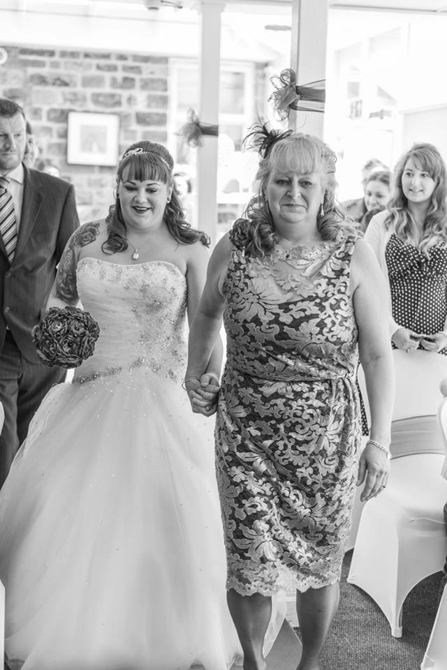 Walking up the aisle with mother of the bride